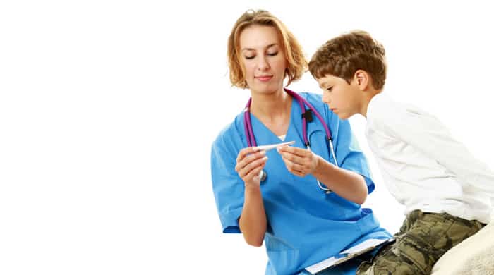 A female doctor is measuring boy's temperature